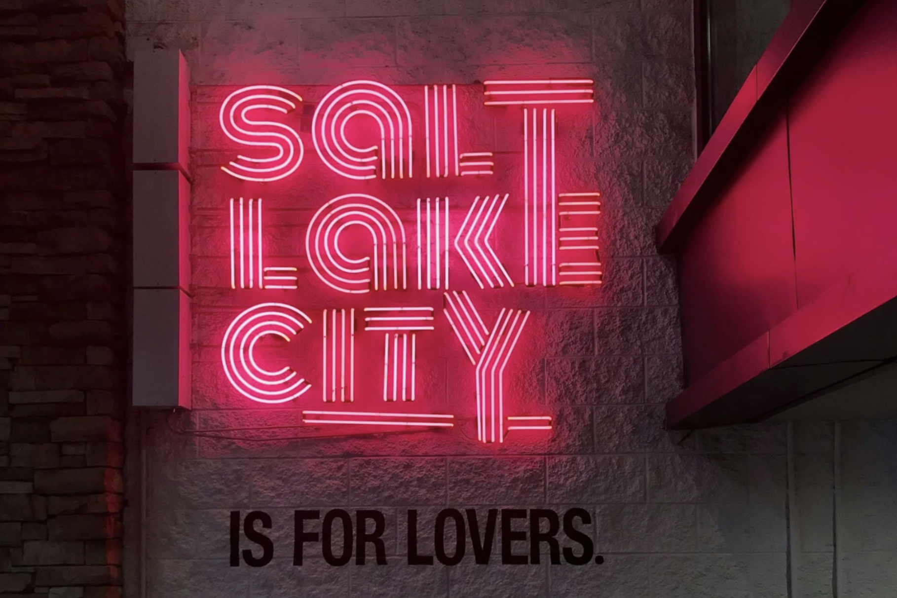 Pink neon sign reading “Salt Lake City is for lovers”